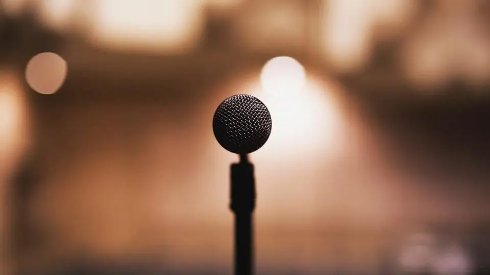 A microphone in warm, blurred light