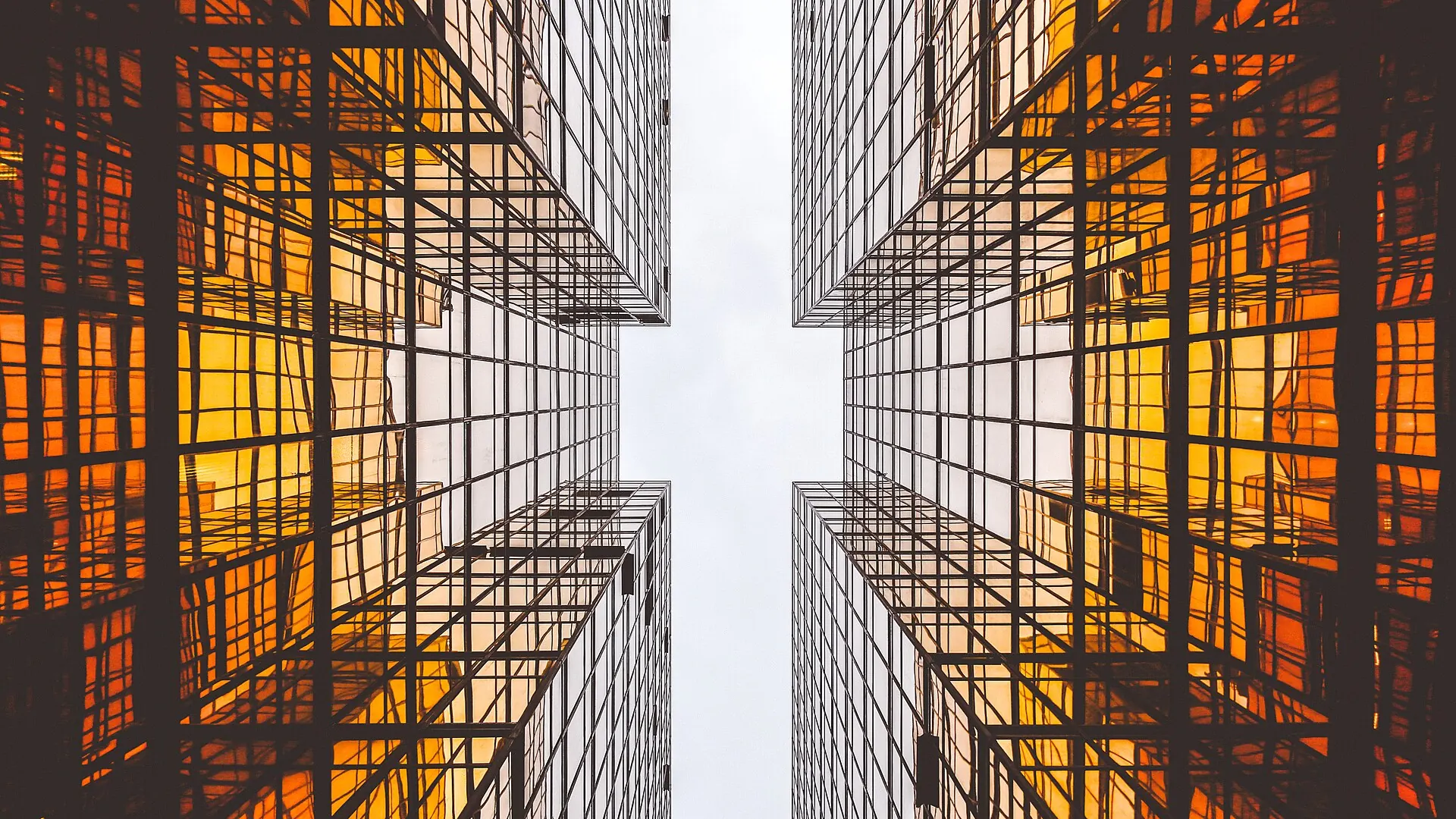 Orange glass towers seen from below